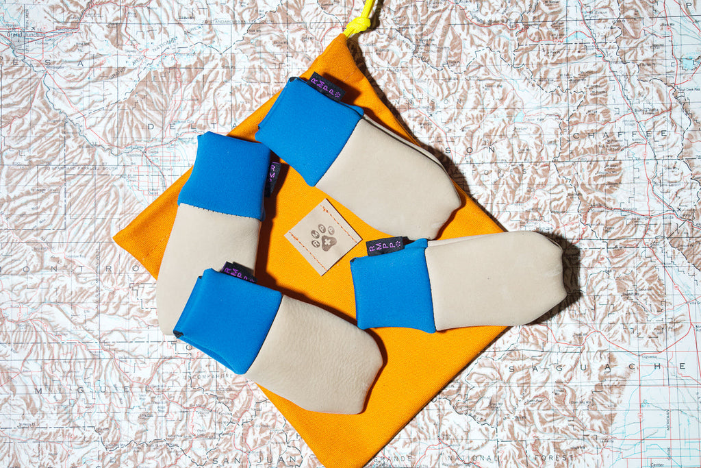 Leather Dog Boots shown on a map with a bag